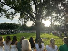 Camp Mystic alumnae and family sing after a memorial service on July 7, 2025, honoring victims of the flash floods in Central Texas over the Fourth of July weekend.