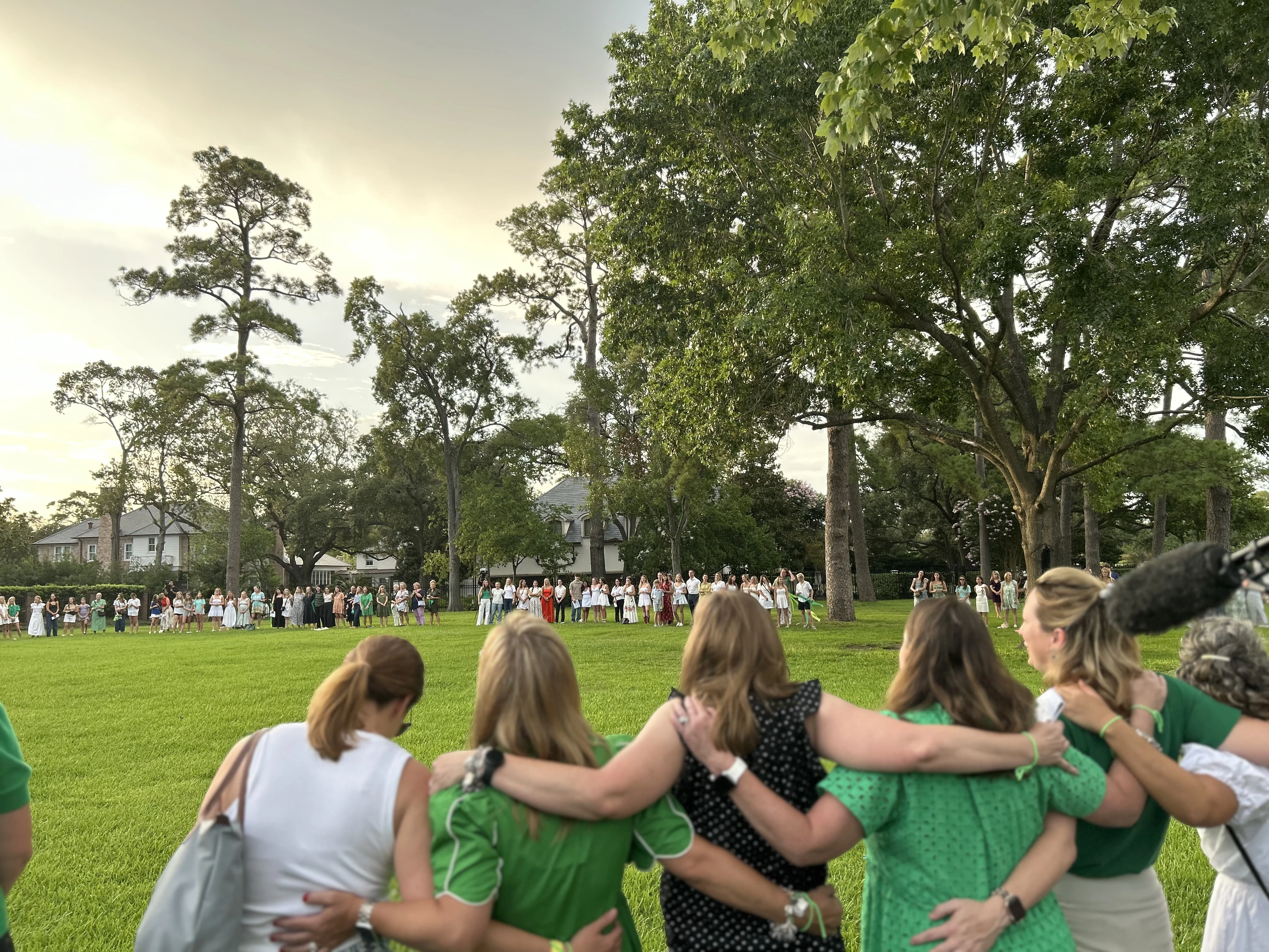 Camp Mystic alumnae sing songs after a memorial service on July 7, 2025, for the young campers who perished in floods last week.?w=200&h=150