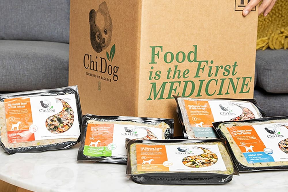 box of Chi Dog food with five different recipes on a table